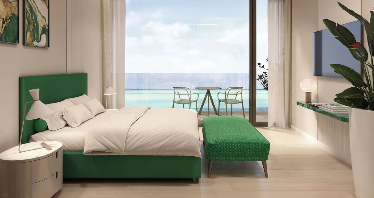Visualisierung: Schlafbereich eines Studios mit Balkon und Meerblick